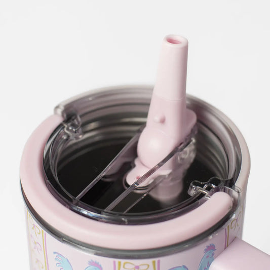 Pink tumbler with a straw lid on a white background