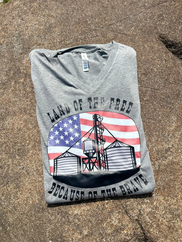 grey tee with a flag graphic on a textured background