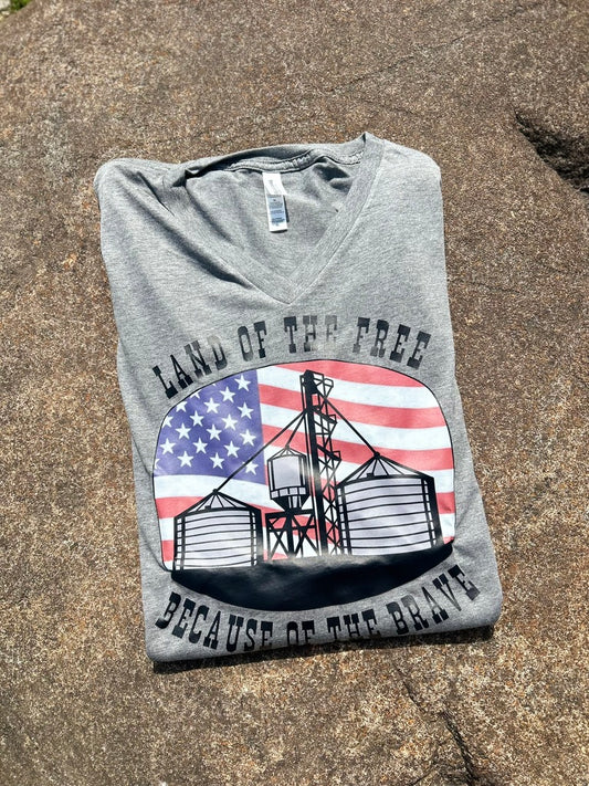 grey tee with a flag graphic on a textured background