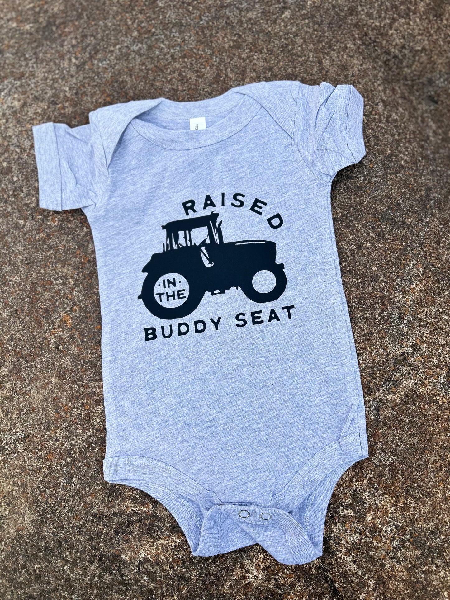grey onesie on a concrete background
