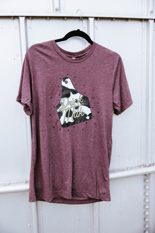 Maroon shirt hanging on a grey grain bin