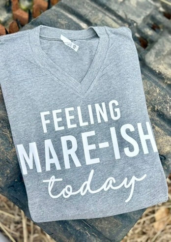 Gray V-neck shirt with 'Feeling Mare-ish today' text on a rustic background
