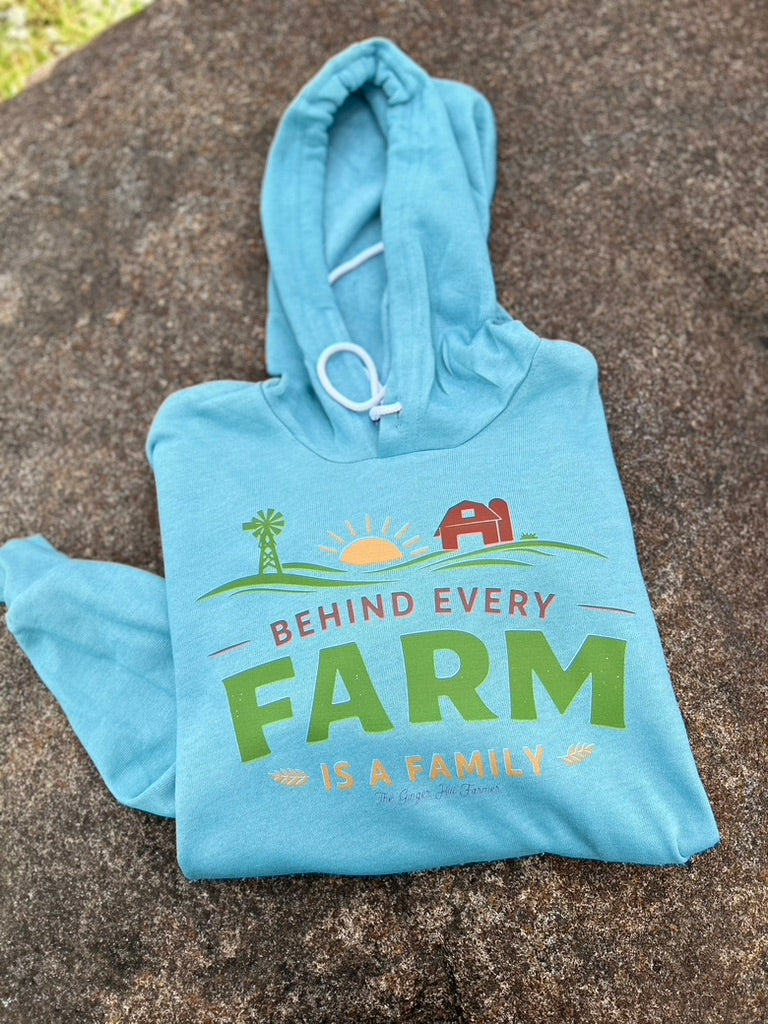 blue hoodie with behind every farm is a family graphic