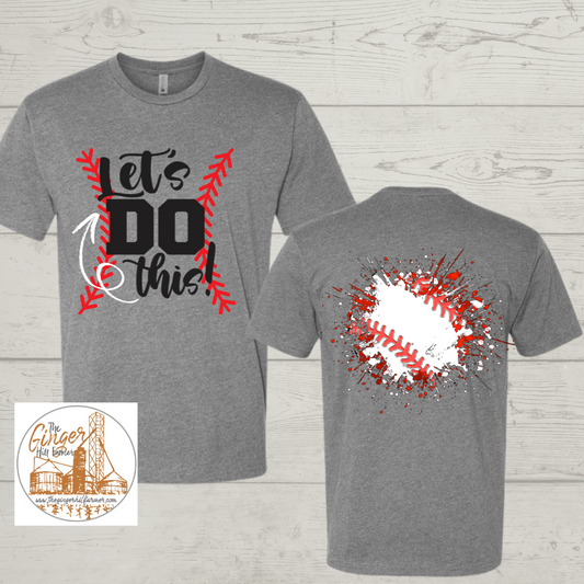 Gray t-shirt with 'Let's Do This!' design on front and baseball graphic on back, on a wooden surface.