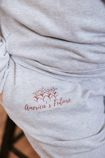Gray sweatshirt with 'America's Future is on the Farm' logo