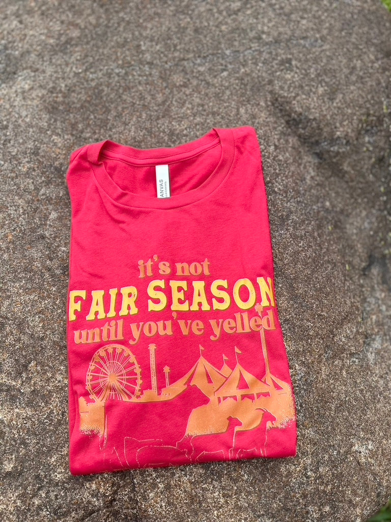 red tee with orange and yellow graphic 