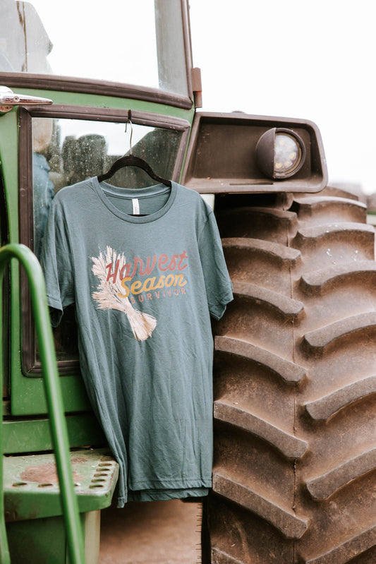 Green tee shirt hanging on a tractor