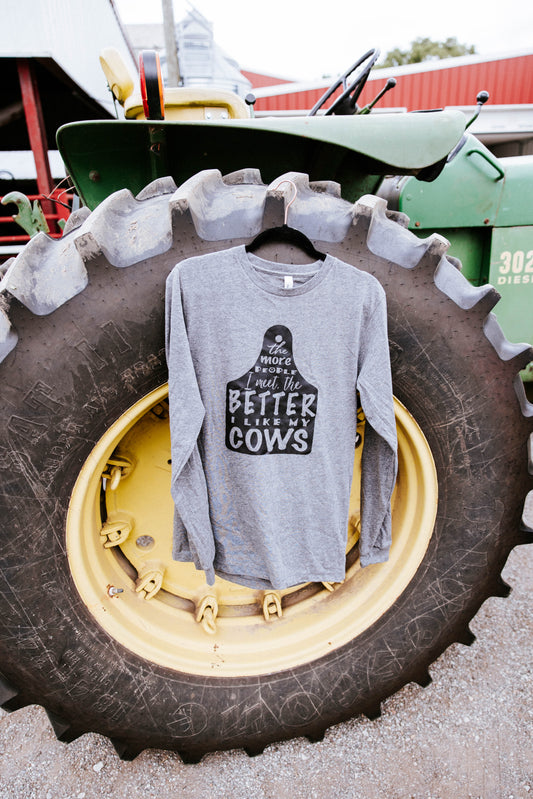 Grey shirt hanging on a green tractor