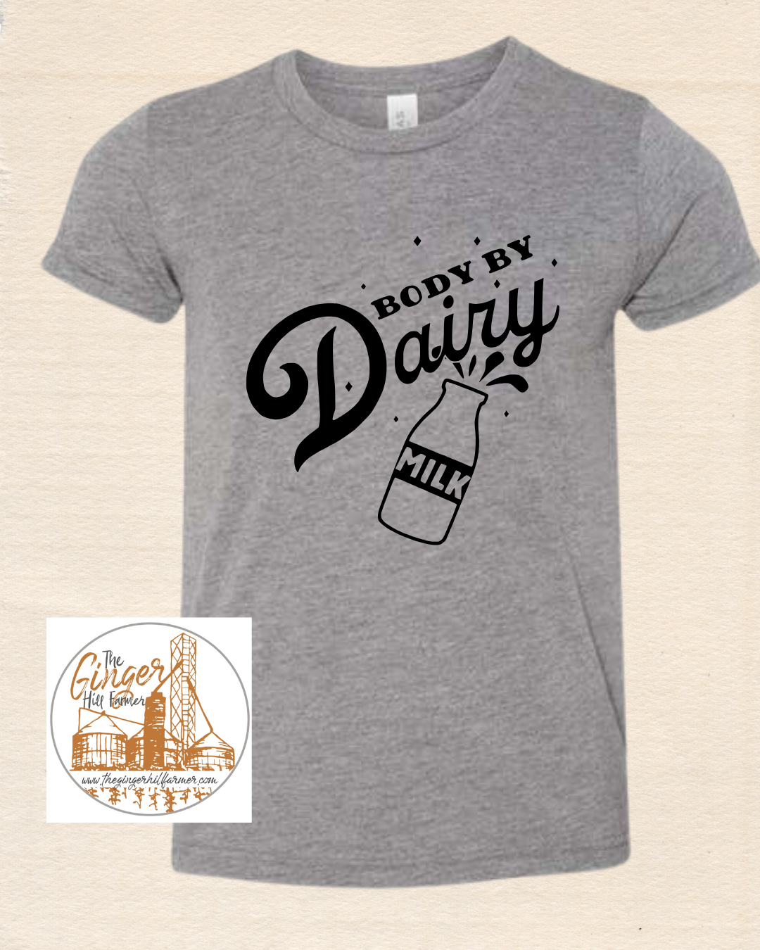 Gray t-shirt with 'Body by Dairy' text and milk bottle graphic on a beige background