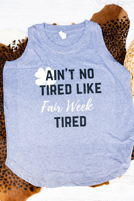 grey tank top with humorous text design on a patterned background