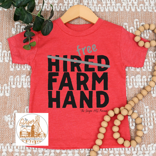 red tee on a brown background