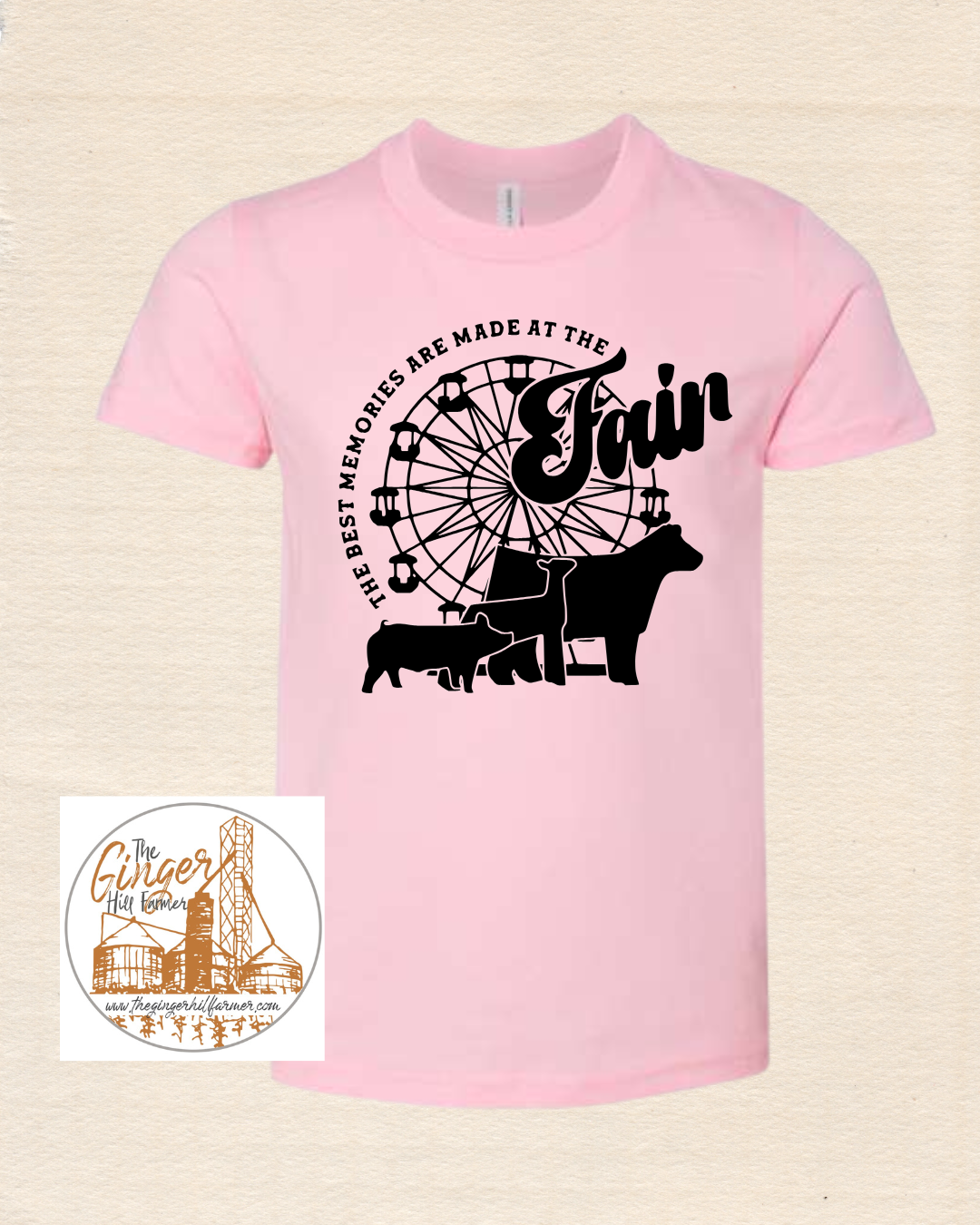 Pink t-shirt with black graphic design on a beige background