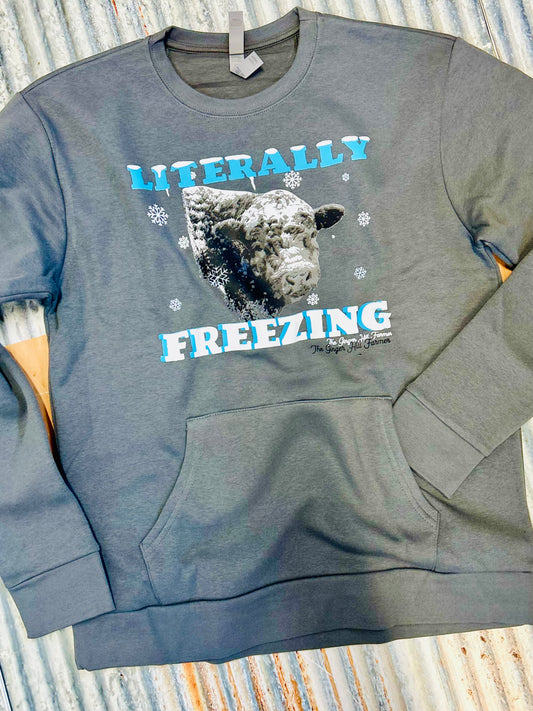 grey sweatshirt laying on tin background