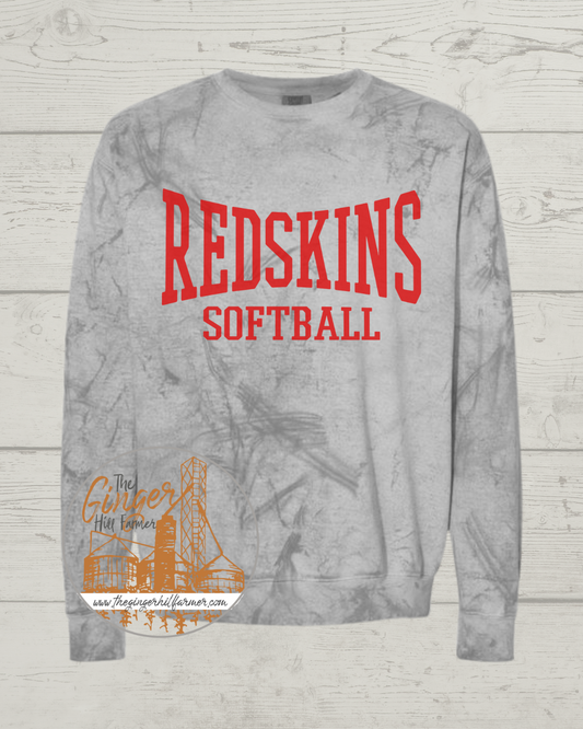 Gray sweatshirt with 'Redskins Softball' text on a wooden surface
