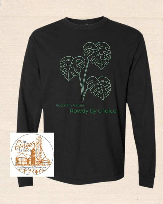 black long sleeve tee with green plant on a beige background