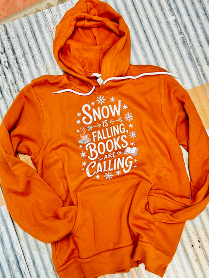 autumn colored hoodie on metal background