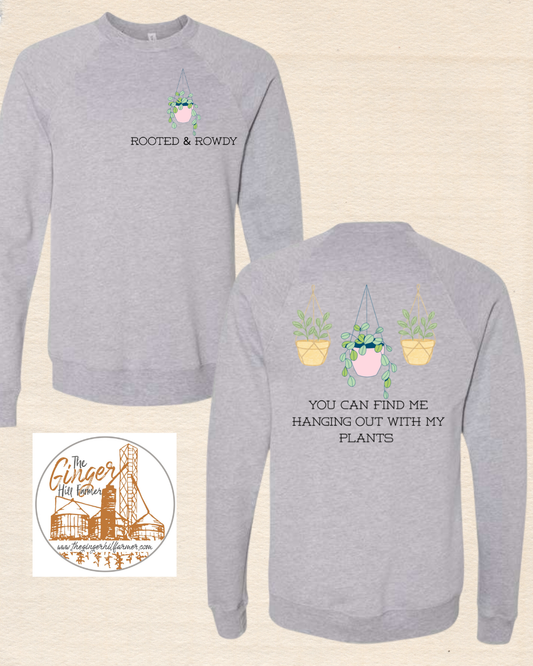 Gray sweatshirt with 'Rooted & Rowdy' design on front and plant-themed text on back, with a smaller image of a logo at the bottom.