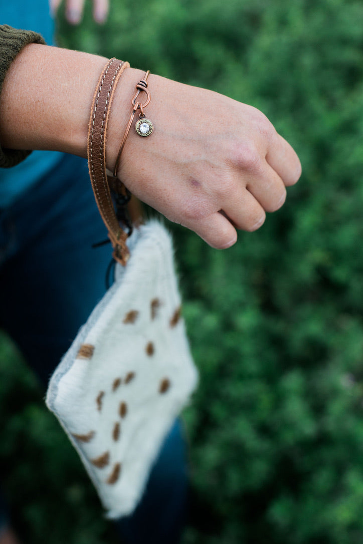 White & Brown Hair-on Wristlet on model's wrist