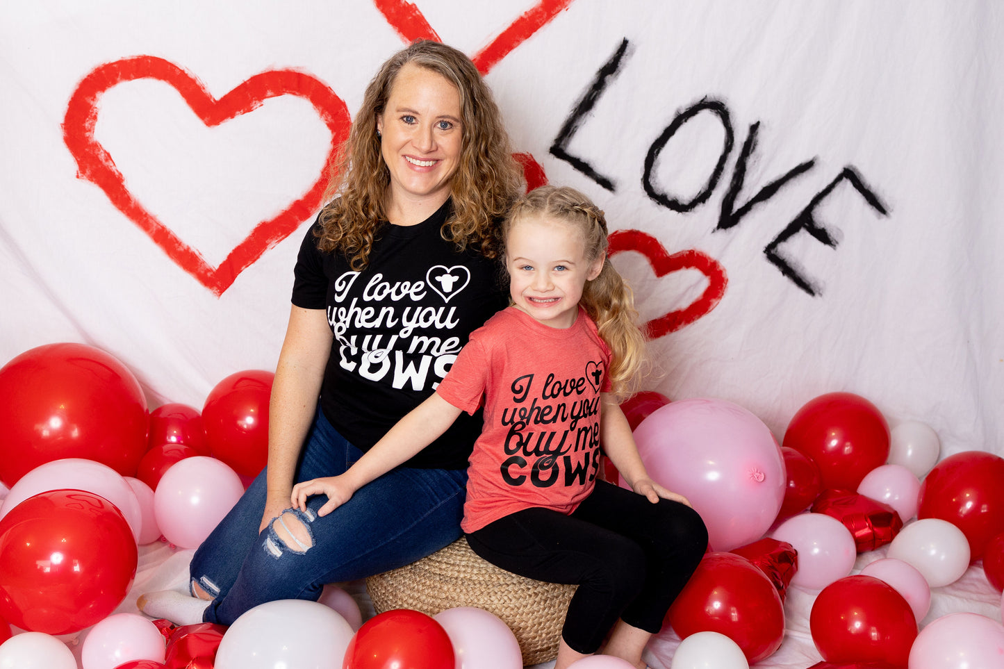 I love when you buy me cows t-shirt on adult model and child model with red and pink balloons